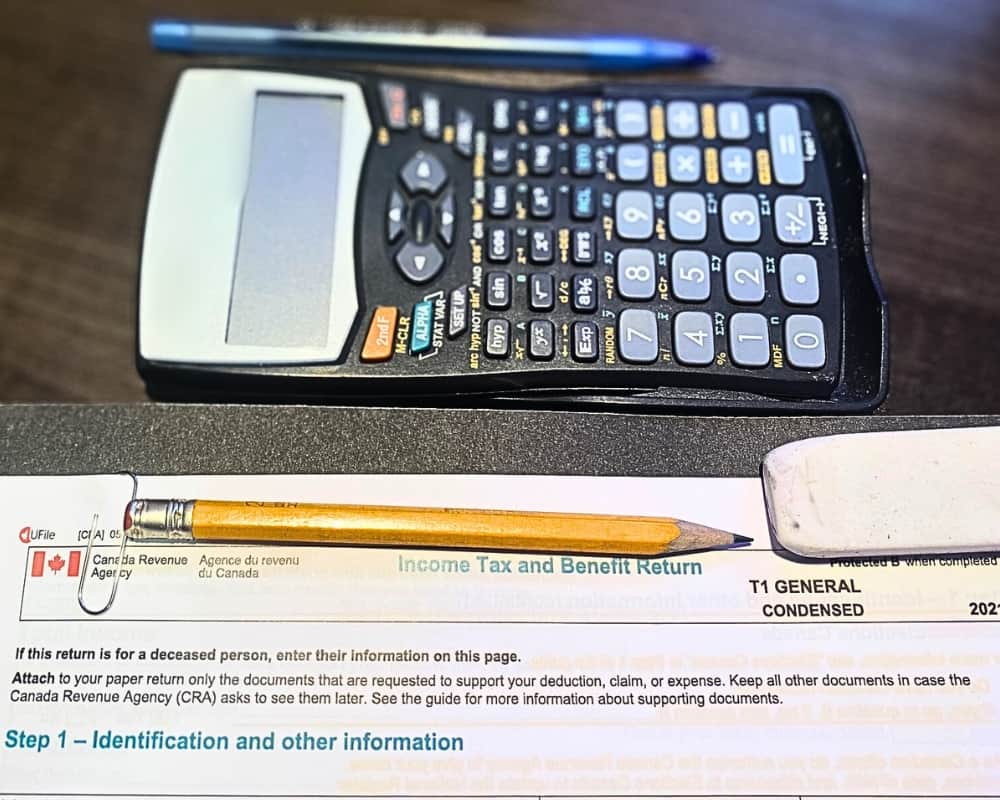 Canada Revenue Agency T1 General  partial with calculator, pen, pencil and eraser.