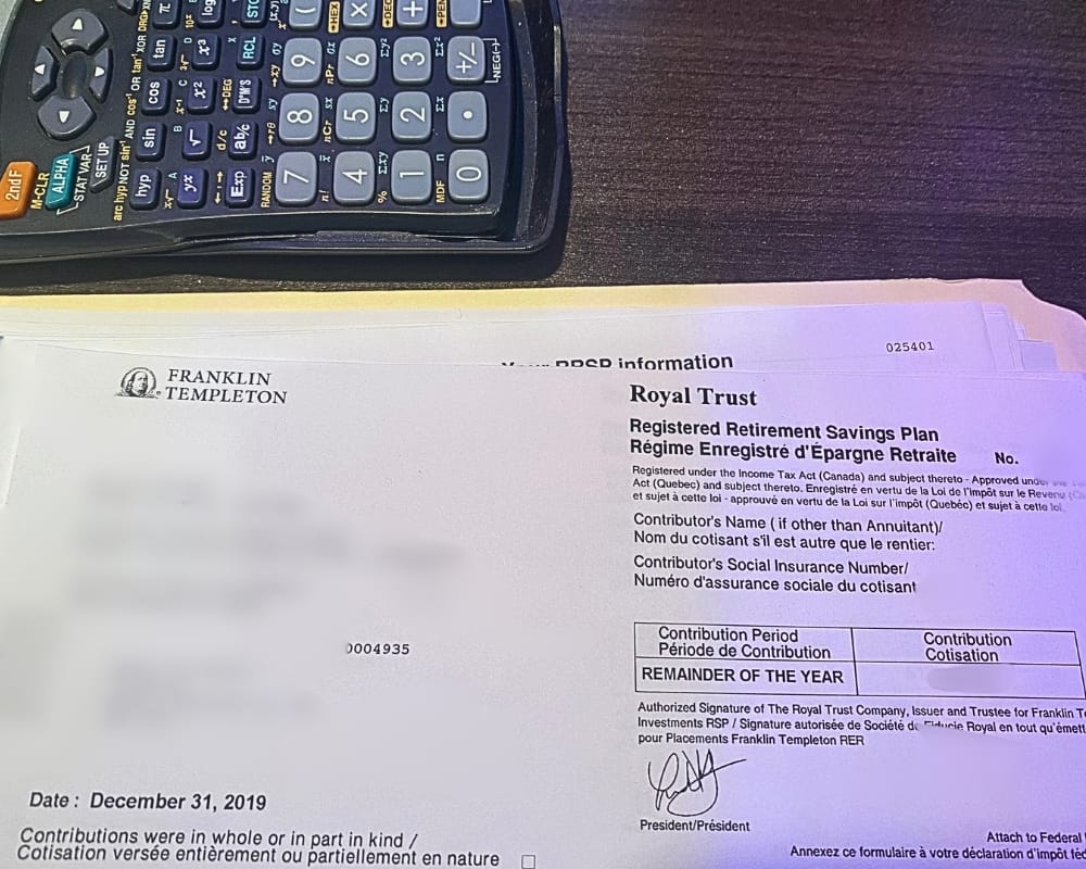 RRSP contribution slip with part of a calculator.