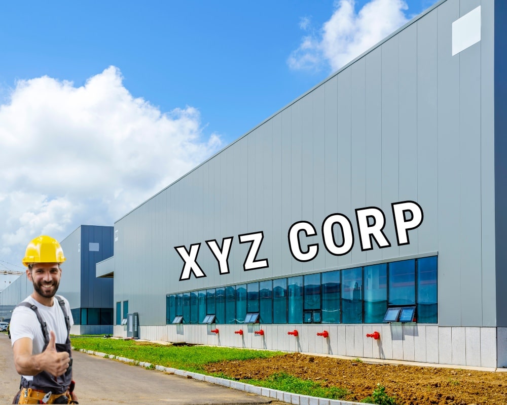 Commercial building with XYZ Corp on side, with tradesman standing with thumbs up.